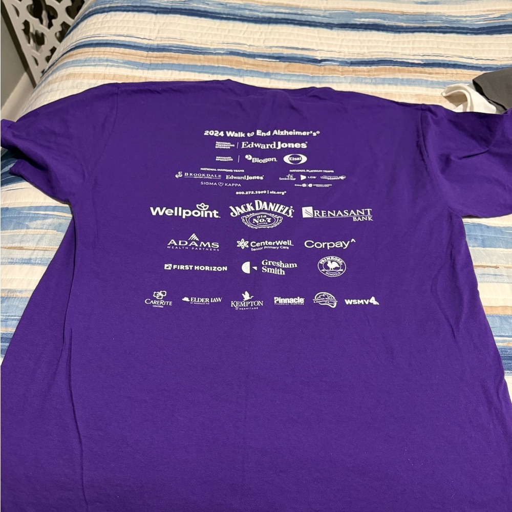 3 T-shirts 1) white save the TaTas
2) purple AA 
3) purple AA walk T-shirt
